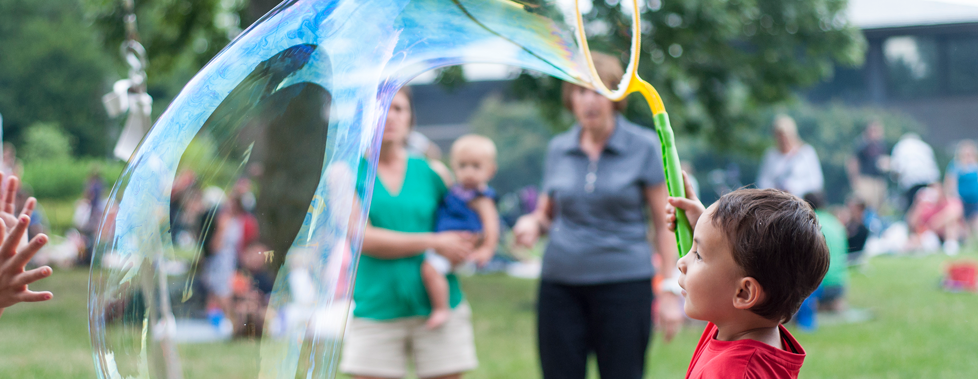 members picnic, kid holding a giant bubble