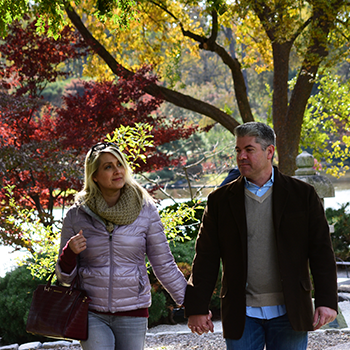 couple walking through the gardens in the fall